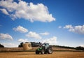 Tractor carrying hay at the field Royalty Free Stock Photo