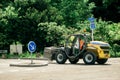 Tractor carrying metallic fence supports