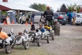 Tractor carrying people in cow toy train cars