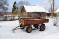 Tractor cart. Rural landscape in the winter