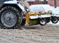 Tractor clean snow in courtyar Royalty Free Stock Photo