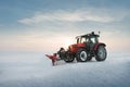 Tractor cleaning snow