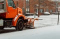 Tractor cleaning snow in field Royalty Free Stock Photo