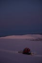 Tractor cleaning snow on the ski slopes in the Alps Royalty Free Stock Photo