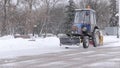 Tractor cleaning snow snowthrower