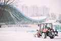 Tractor Cleaning Snow In Winter Snowy Snowstorm Day In City