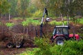 Tractor cleaning up forest debris