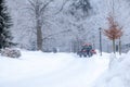 tractor cleans road from snow in the winter Royalty Free Stock Photo