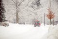 tractor cleans road from snow in the winter