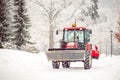 tractor cleans road from snow in the winter Royalty Free Stock Photo