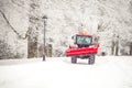 tractor cleans road from snow in the winter Royalty Free Stock Photo