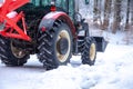 tractor cleans road from snow in the winter Royalty Free Stock Photo