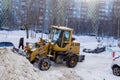 Tractor cleans snow.