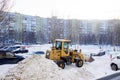 Tractor cleans snow.