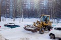 Tractor cleans snow.