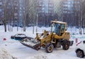 Tractor cleans snow.