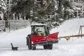 Tractor clears the way after heavy snowfall in Riga Royalty Free Stock Photo