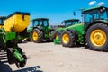 Tractor, combine at a field in sunlight. Confident, bright colors Royalty Free Stock Photo