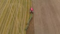 Tractor cultivates farmland with modern trailer plow