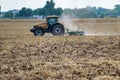 Tractor cultivating the field