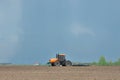 Tractor cultivating the field