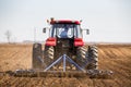 Tractor cultivating field at spring Royalty Free Stock Photo