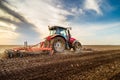 Tractor cultivating field at spring Royalty Free Stock Photo