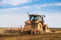 Tractor cultivating field at spring Royalty Free Stock Photo