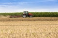 Tractor cultivating wheat stubble field, crop residue Royalty Free Stock Photo