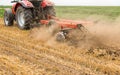 Tractor cultivating wheat stubble field, crop residue Royalty Free Stock Photo