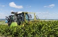 Tractor Cutting Vines in Vineyard