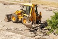 Bulldozer Dismantles Asphalt at Work