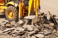 Bulldozer Dismantles Asphalt at Work