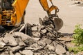 Bulldozer Dismantles Asphalt at Work