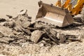 Bulldozer Dismantles Asphalt at Work