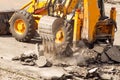 Bulldozer Dismantles Asphalt at Work