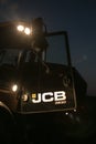 Tractor door with headlights on at night time