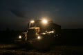 Tractor door with headlights on at night time