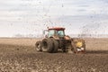 Tractor with double wheeled ditcher digging drainage canal