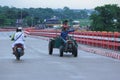 Sunamganj, Bangaldesh- October 11,2016: A tractor driver is driving over bridge and pointing at something