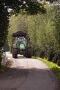 Tractor driving on country road