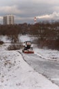 Tractor driving down a snow road Royalty Free Stock Photo