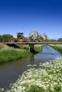Tractor driving over bridge Royalty Free Stock Photo