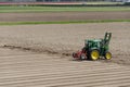 Tractor in dutch field after harvest near keukenhof