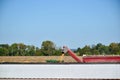 Tractor emptying its load of harvested corn Royalty Free Stock Photo