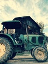 FARM LIFE: A green tractor sits in front a farm in Akron, Ohio Royalty Free Stock Photo