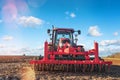 farmer equip with seeder and harrow