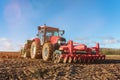 farmer equip with seeder and harrow