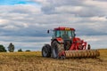 Tractor in european countryside. Harvest season