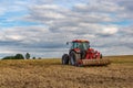 Tractor in european countryside. Harvest season